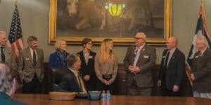 Jess Johnson and Decision Makers at a Bill Signing