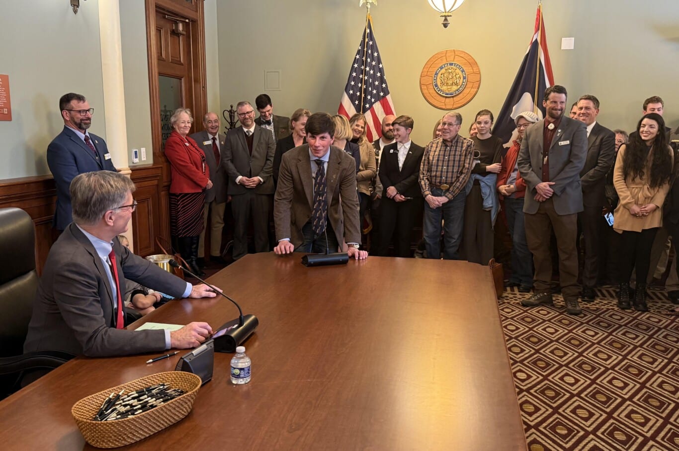 WWF Civic Engagement Fellow Colton Schick thanks Governor Gordon for signing SJ 0009.